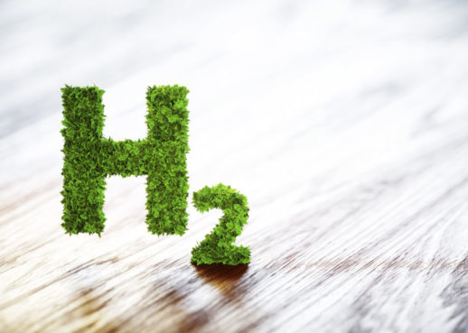 Green hydrogen element sign on blurred wooden background. 3D illustration.