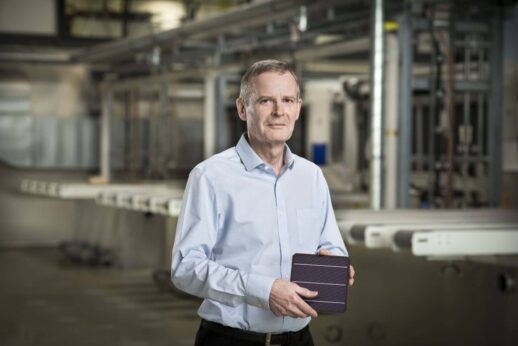 Oxford-PV_Frank-P-Averdung-inside-Oxford-PV-Germany-holding-perovskite-tandem-solar-cell-1536x1025