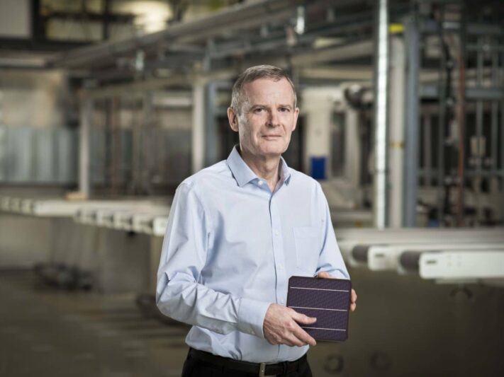 Oxford-PV_Frank-P-Averdung-inside-Oxford-PV-Germany-holding-perovskite-tandem-solar-cell-1536x1025